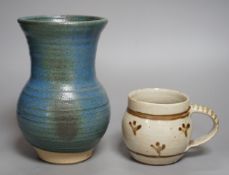 An Accolay style blue glazed stripe vase, together with a Wenford Bridge stoneware mug, both with
