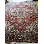 A Heriz red ground carpet, 390 x 298cm