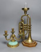 A novelty brass trumpet table lamp and three sconce brass candelabra, trumpet lamp 44cms high