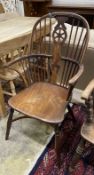 A mid 19th century yew and elm Windsor armchair, width 57cm, depth 44cm, height 102cm
