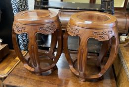 A pair of Chinese carved hardwood vase stands, diameter 36cm, height 47cm