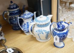 An early 19th century pearlware blue and white tea pot, two others and a Wedgwood style teapot,