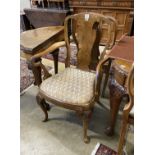 A set of eight Queen Anne revival walnut dining chairs, (two with arms, six single)