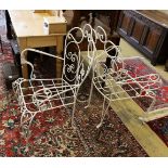 A pair of white painted wrought iron wirework garden chairs, width 74cm, height 94cm