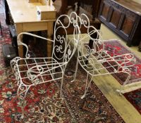 A pair of white painted wrought iron wirework garden chairs, width 74cm, height 94cm