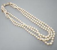 A modern triple strand graduated cultured pearl choker necklace, with diamond chip set white metal