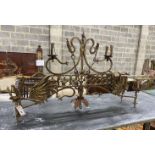 A medieval style gilt painted wrought iron hanging candle holder, width 106cm, height excluding