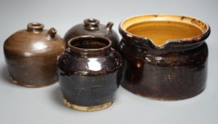 Two 19th century Chinese tenmoku glazed soy sauce jars, a similar jar and a pouring vessel,