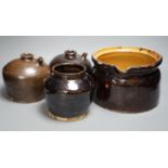 Two 19th century Chinese tenmoku glazed soy sauce jars, a similar jar and a pouring vessel,
