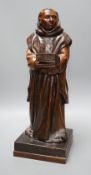 A carved wooden figure of a friar, 48cms high