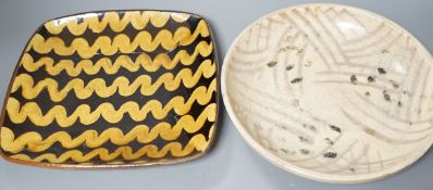 British studio pottery; Doug Fitch (b.1964), a moulded square platter with brown and yellow slip