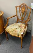 An Edwardian Sheraton revival marquetry inlaid satinwood elbow chair