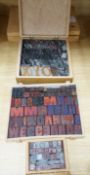 A collection metal letters and boxed printing blocks