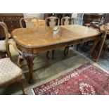 A Queen Anne revival burr walnut extending dining table, approx. 250cm extended, two spare leaves,