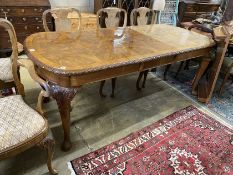 A Queen Anne revival burr walnut extending dining table, approx. 250cm extended, two spare leaves,