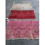 Three antique Salor mats, largest 140 x 82cm