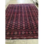 A Bokhara blue ground carpet, 370 x 280cm