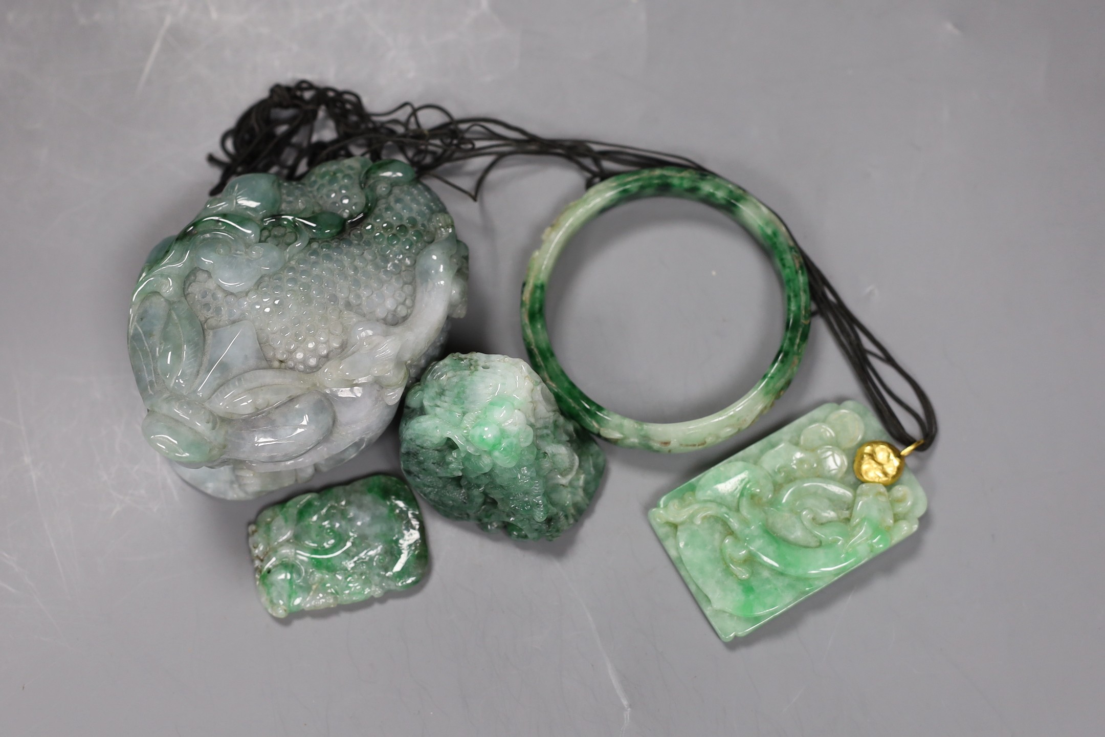 A group of five Chinese jadeite carvings, including two pendants and a bangle, largest 11cms long - Image 2 of 3