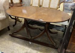 A George III style mahogany twin pedestal D end extending dining table, length 158cm, 248cm