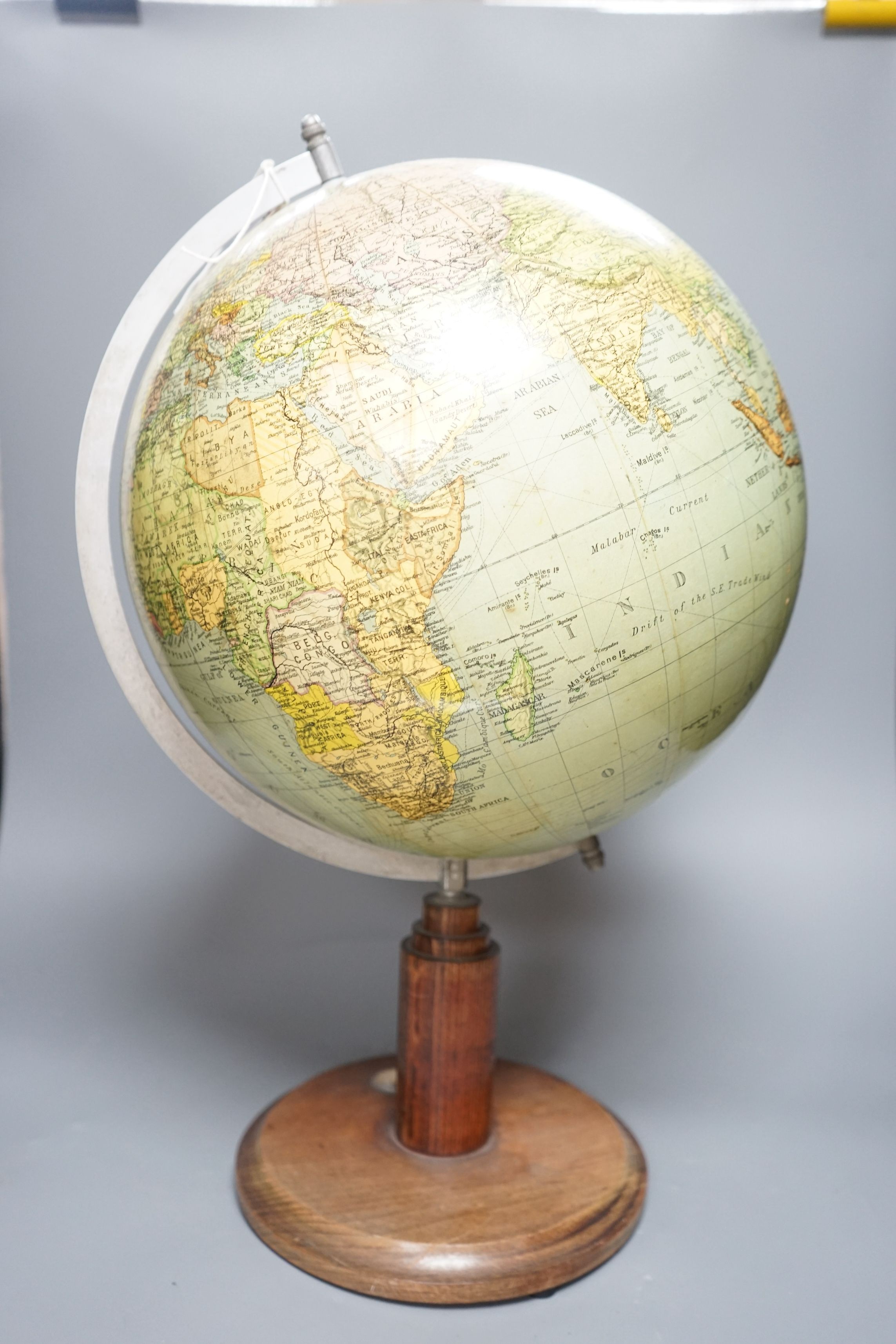 A mid 20th century globe on a revolving stand with an inset compass, 54cms high including stand - Image 2 of 3