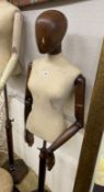 A Victorian style stained beech mannequin on telescopic stand
