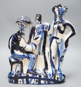 After Picasso, a tin-glazed blue and white figural studio pottery group of an artist and their muse,