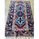 A Caucasian blue ground rug, 200 x 118cm
