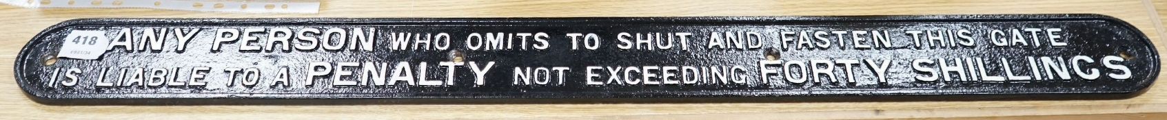 A cast iron gate closing and fastening penalty sign, 103cms