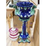 A 19th century majolica jardiniere on pedestal and a two handled jar and cover, jardiniere and stand