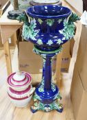 A 19th century majolica jardiniere on pedestal and a two handled jar and cover, jardiniere and stand