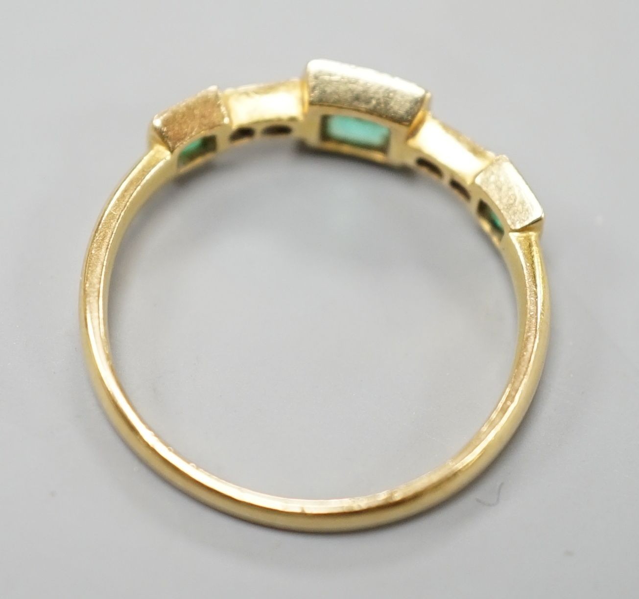 A George V 18ct gold, three stone emerald and four stone diamond chip set half hoop ring, size L, - Image 3 of 4