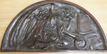 A demi-lune cast bronze panel depicting a weeping angel, signed DEBO, 49.5 x 26.5cm