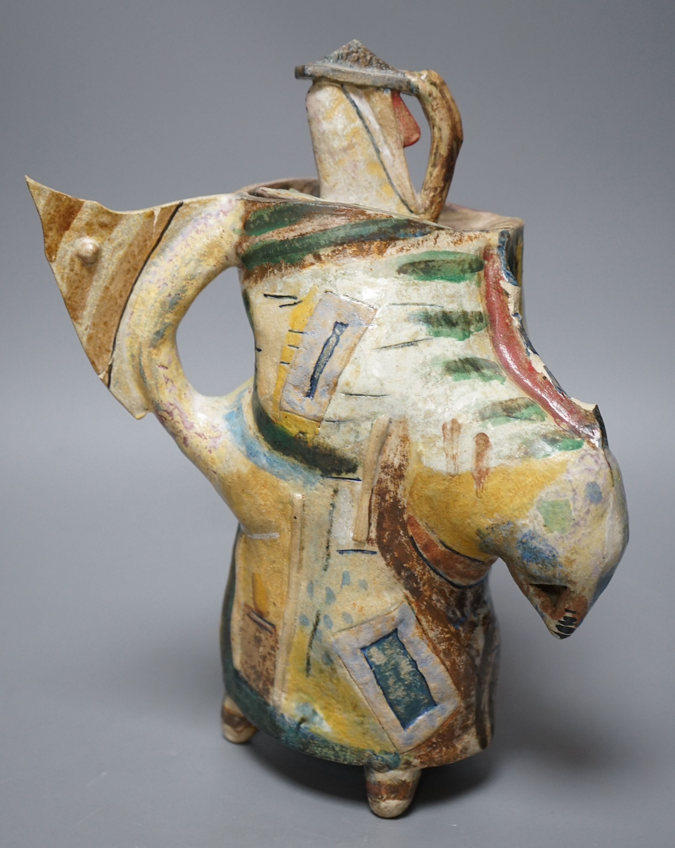Angus Suttie (1946-1993), an abstract polychrome glazed stoneware jug and cover on tripod base,