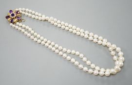 A modern double strand graduated cultured pearl necklace, with amethyst and cultured pearl cluster