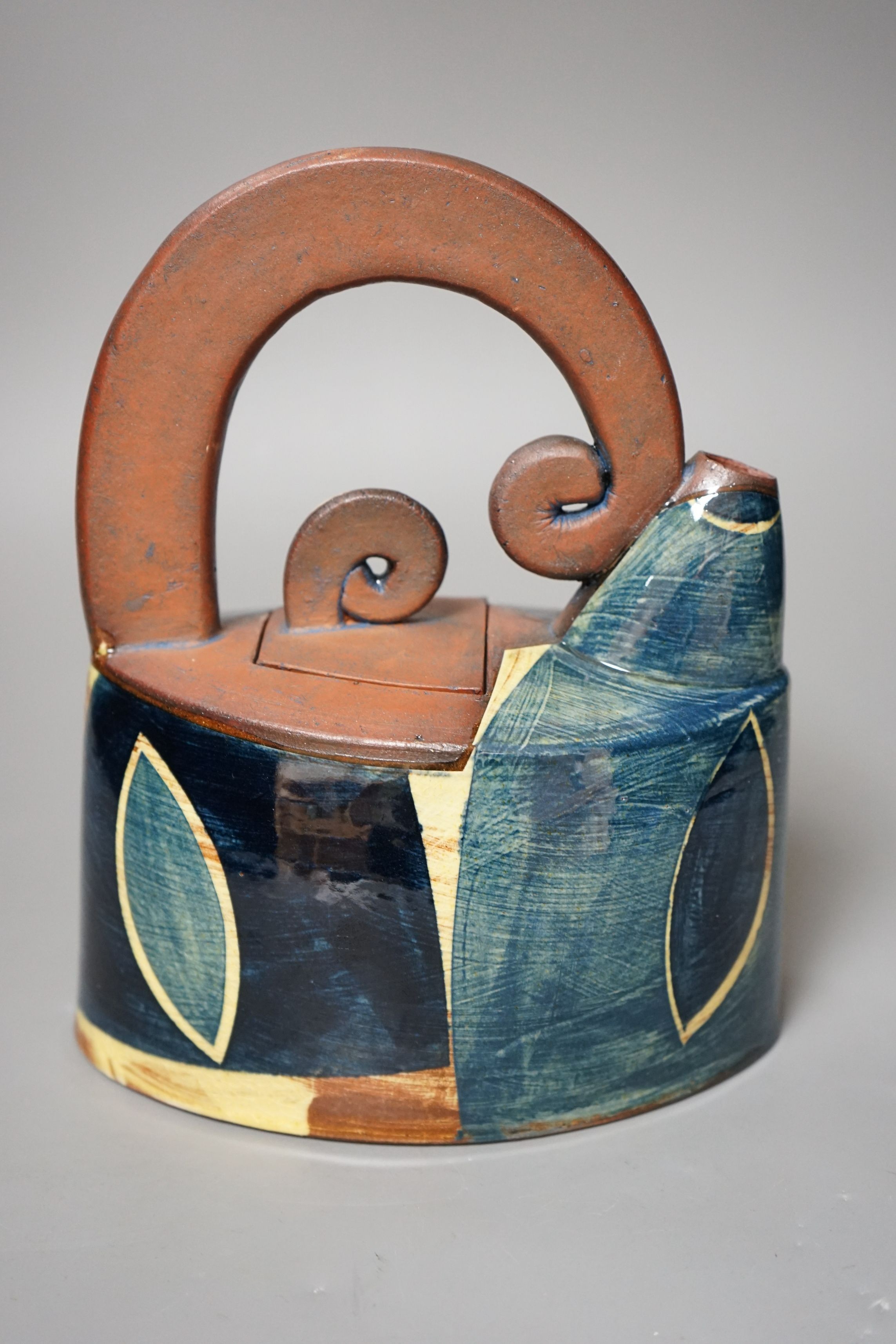 Richard Phethean (b.1953), an abstract green yellow and blue glazed earthenware teapot, purchased
