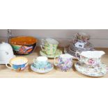 A Clarice Cliff tea cup, a collection of chintz patterned teaware, a lustre bowl and a honey pot and