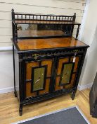 A Victorian aesthetic movement ebonised and bird's eye maple two door side cabinet, inset painted