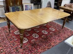 An early Victorian mahogany rectangular extending dining table, length 220cm extended, three spare
