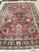 An Heriz red ground floral carpet, 310 x 226cm