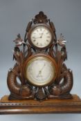 A Victorian oak timepiece combined barometer by Salom & Co., carved with stylised fish and bull