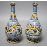 George Tinworth, a pair of Doulton Lambeth vases, stamped 1876, 20cm high