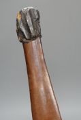 A carved wooden bladed war club, 71cms long
