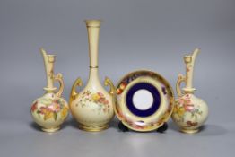 A pair of Royal Worcester blush ivory ewers, a similar vase and a beaded saucer decorated by E.