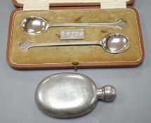 A cased pair of George V silver preserve spoons, Sheffield 1911, 36 grams, an ingot pendant, 15