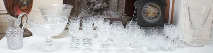Assorted suites of cut glass wine glasses, brandy balloons, a pedestal water jug, two pedestal