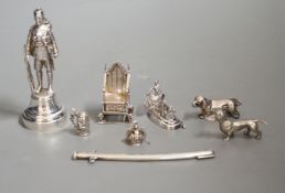 A group of novelty miniature silver items to include a sword, a solider by Goldsmiths & Silversmiths