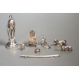 A group of novelty miniature silver items to include a sword, a solider by Goldsmiths & Silversmiths