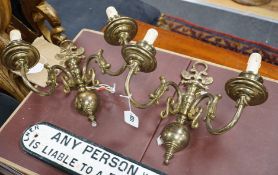 A pair of brass two branch sconces, 35cms high,