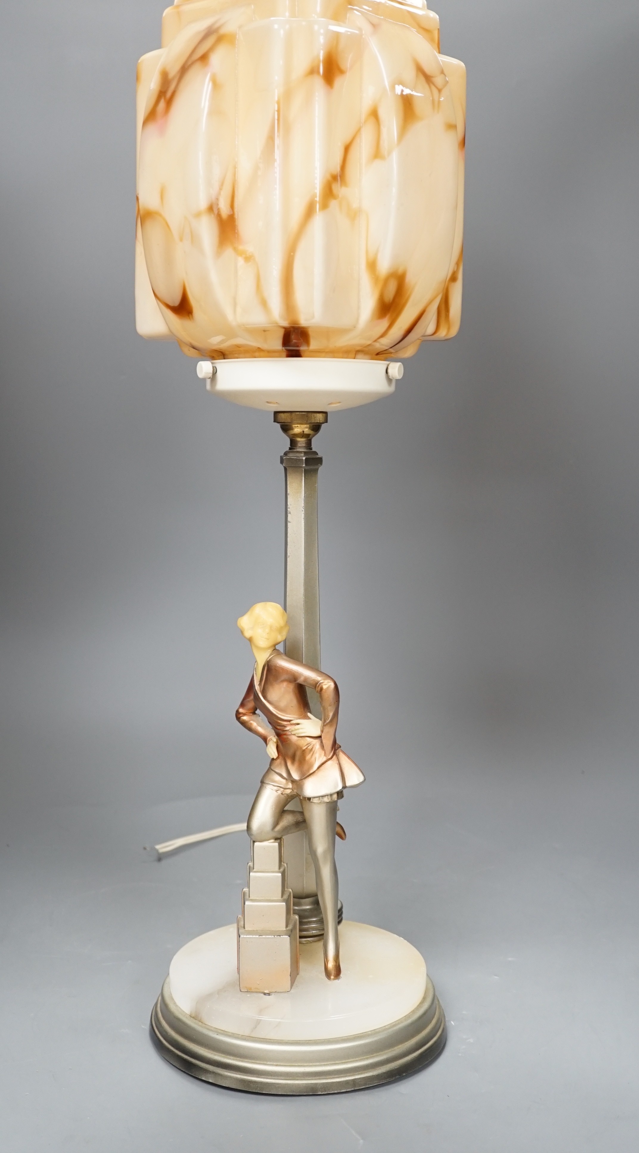 An Art Deco Cold painted spelter and composition figural table lamp and glass shade, 67cm high,