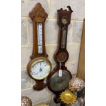 A Cicceri and Co, London wheel barometer and a late Victorian carved oak barometer, larger height